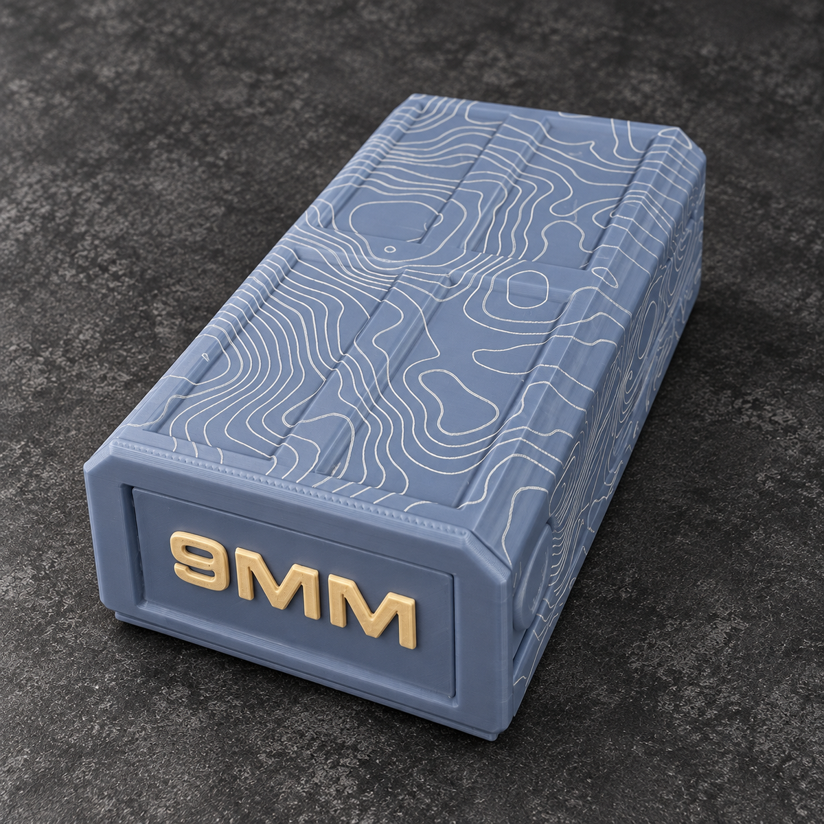 Blue 9MM topographic ammo storage box, closed; ammunition not included