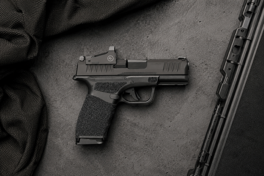 Springfield Hellcat Pro on dark surface