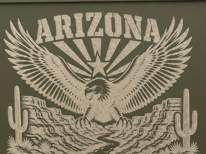 Close-up of the engraved eagle, canyon and saguaros on the can