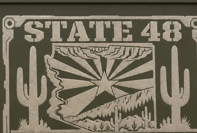 Close-up of the engraved State 48 Arizona design on the can