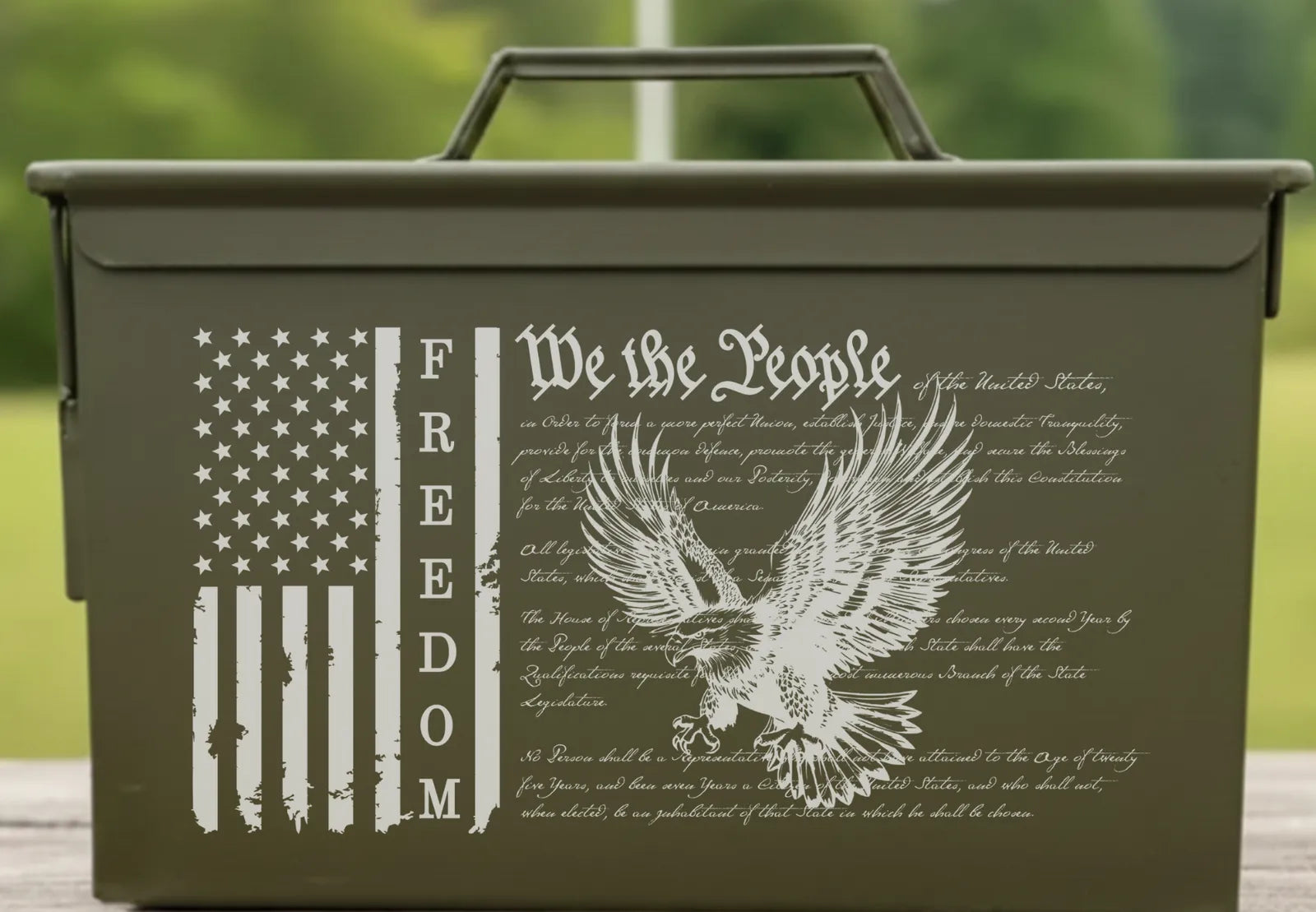 Front of the We The People engraved ammo can: a flag, the word FREEDOM, the Preamble and an eagle