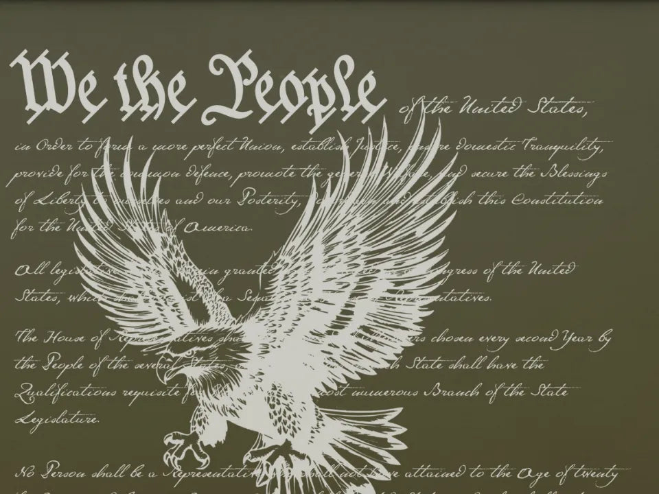 Close-up of the engraving: We the People in large script over the Preamble